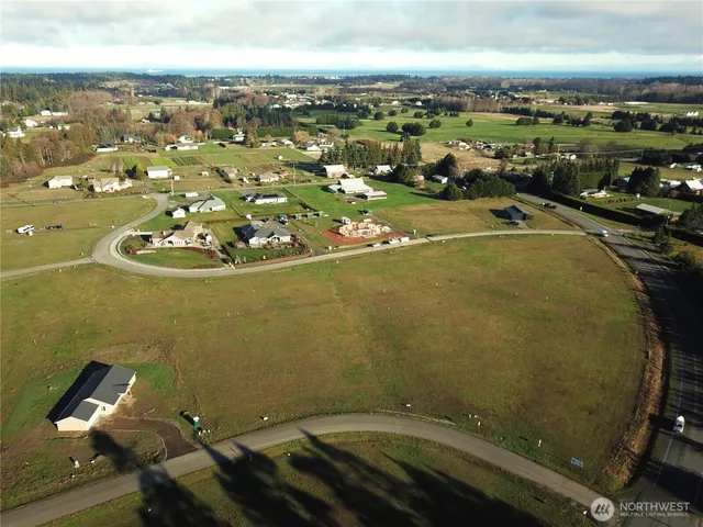 an aerial view of a residential houses with outdoor space