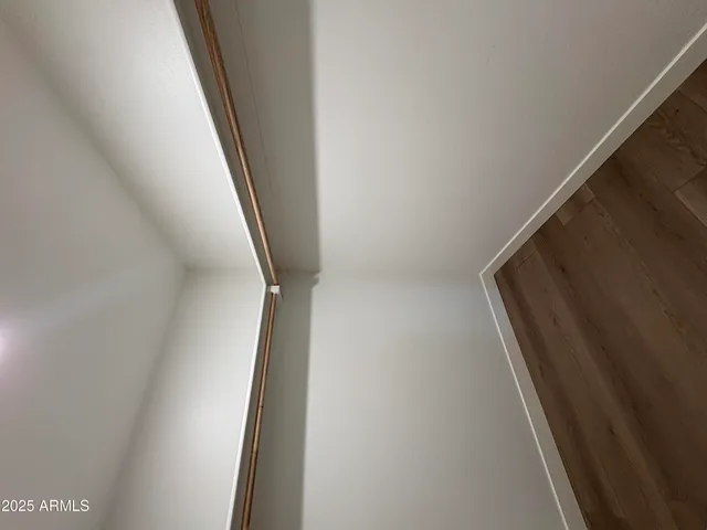 a view of hallway with wooden floor