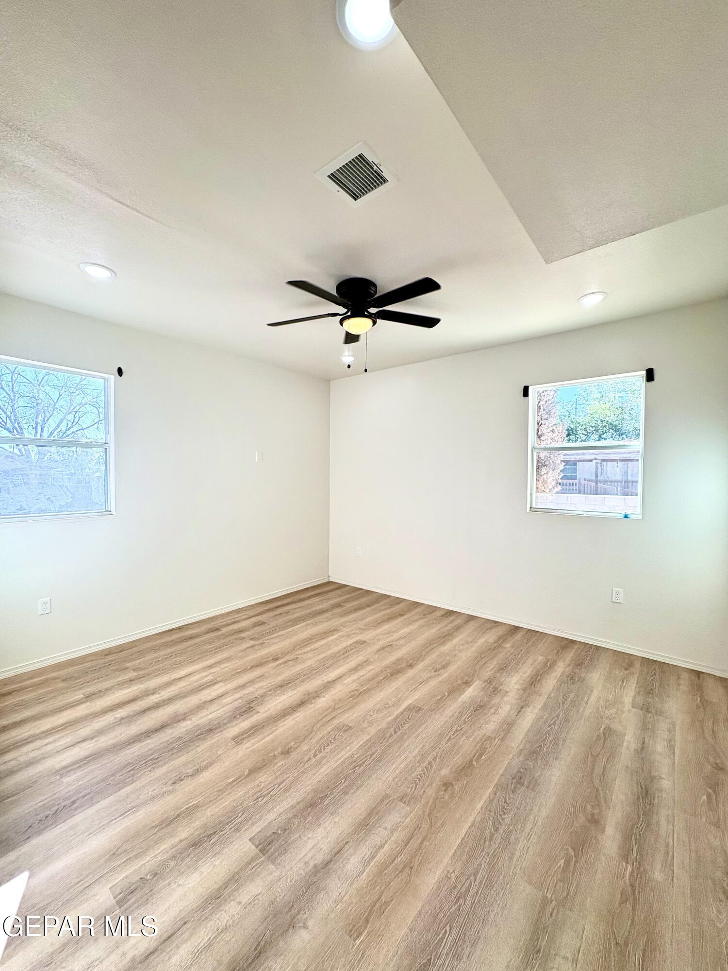 11420 Doris Road Socorro, TX 79927 - Photo 14 of 27 a view of empty room with wooden floor