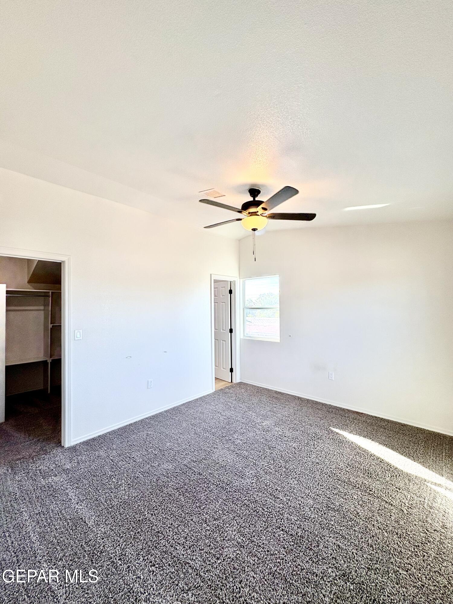 11420 Doris Road Socorro, TX 79927 - Photo 20 of 27 an empty room with a empty space and windows