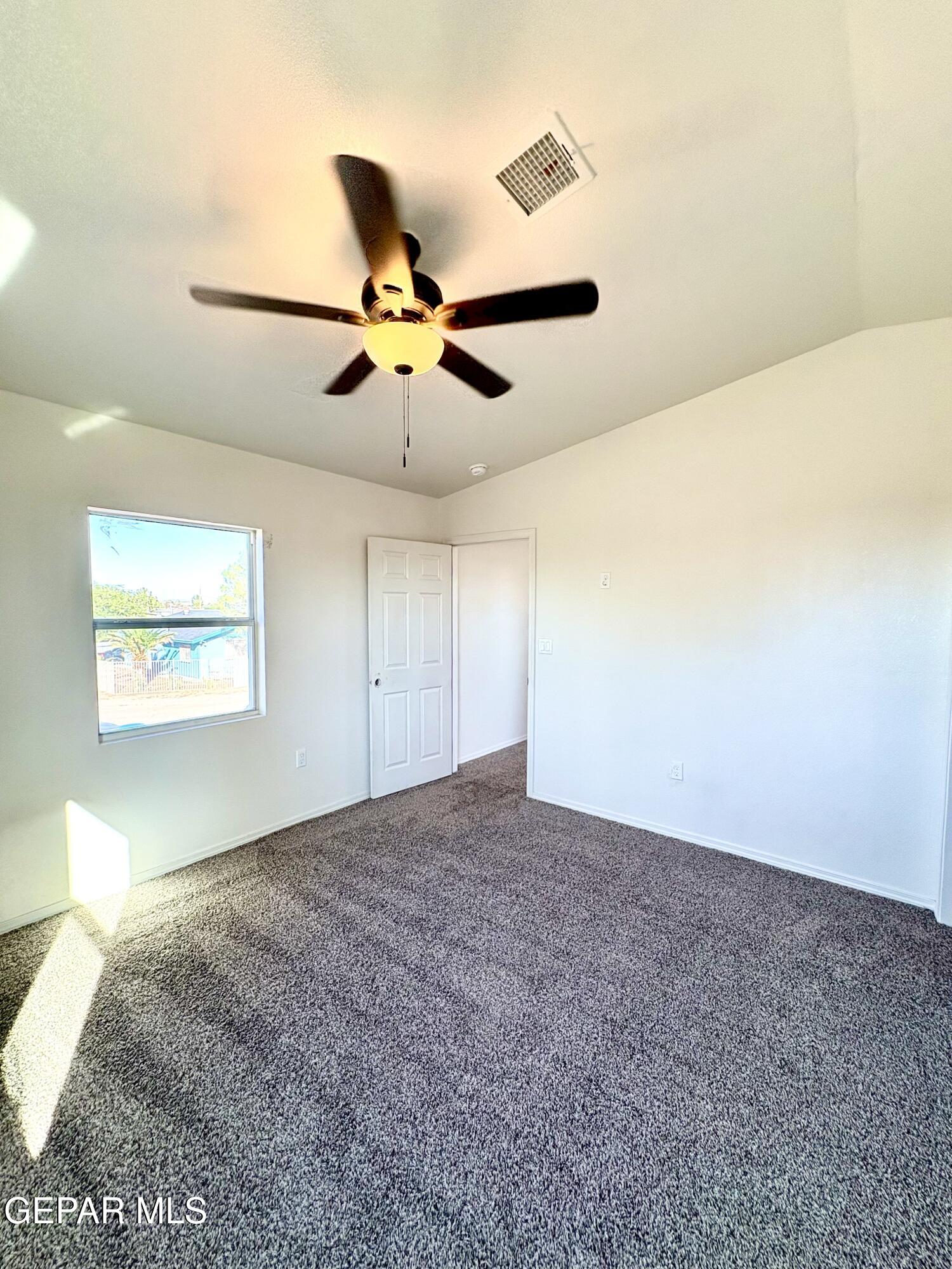 11420 Doris Road Socorro, TX 79927 - Photo 21 of 27 a view of a big room with carpet