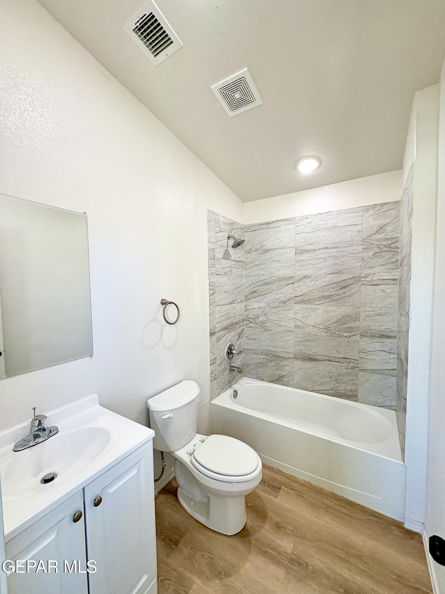 11420 Doris Road Socorro, TX 79927 - Photo 23 of 27 a bathroom with a toilet a sink and a bathtub