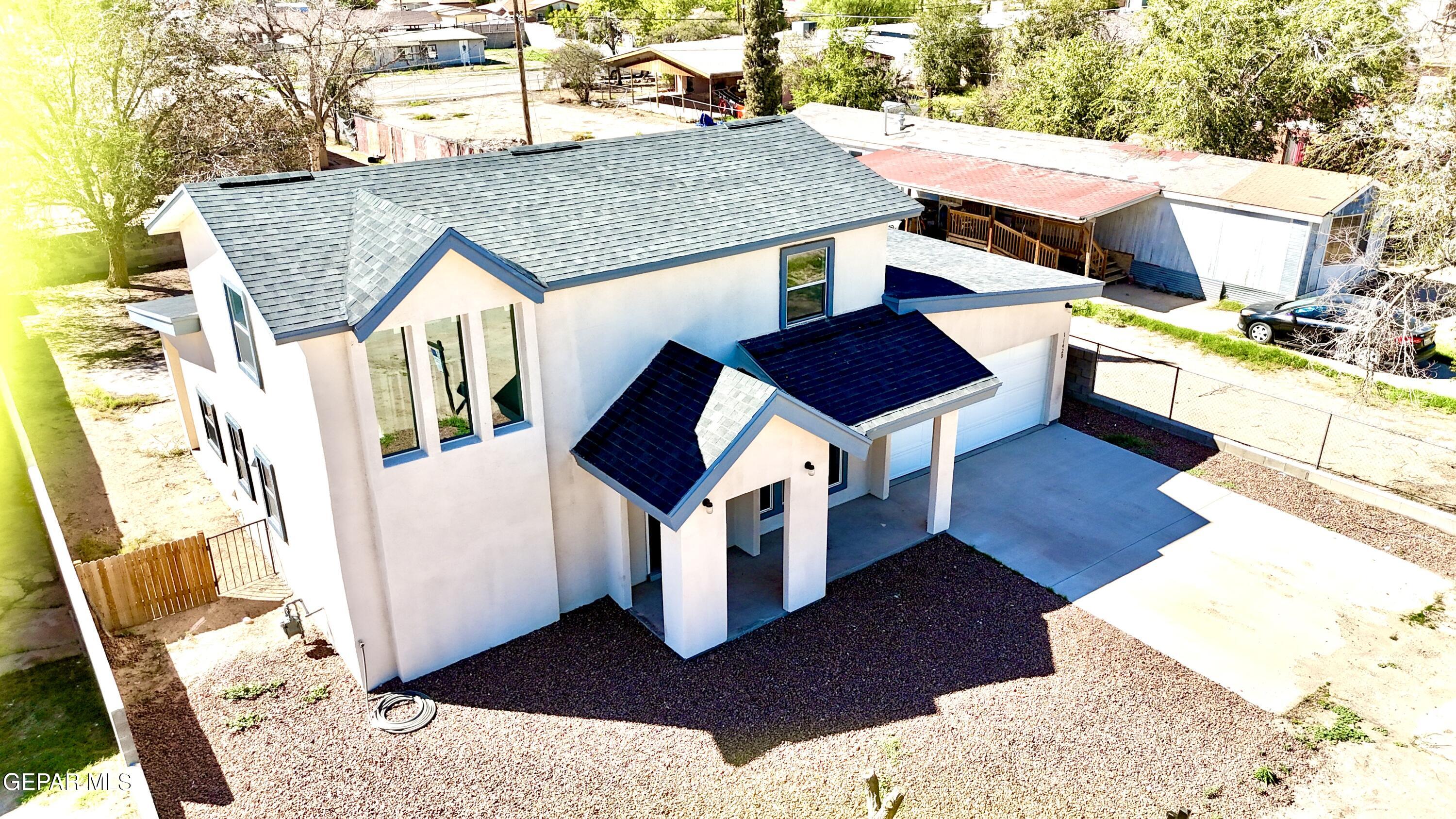 11420 Doris Road Socorro, TX 79927 - Photo 3 of 27 a view of a house with wooden fence