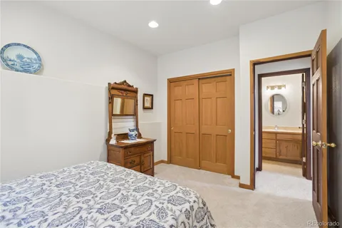 a bedroom with a bed and a table