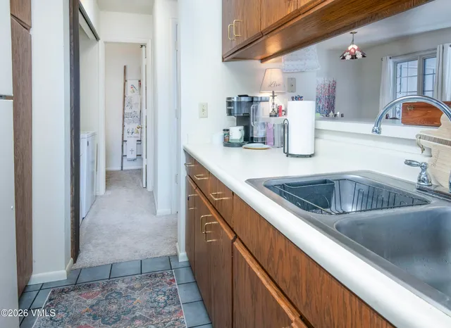 a kitchen with a sink and cabinets