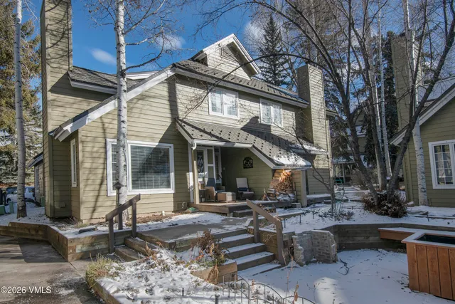 a front view of a building with sitting area