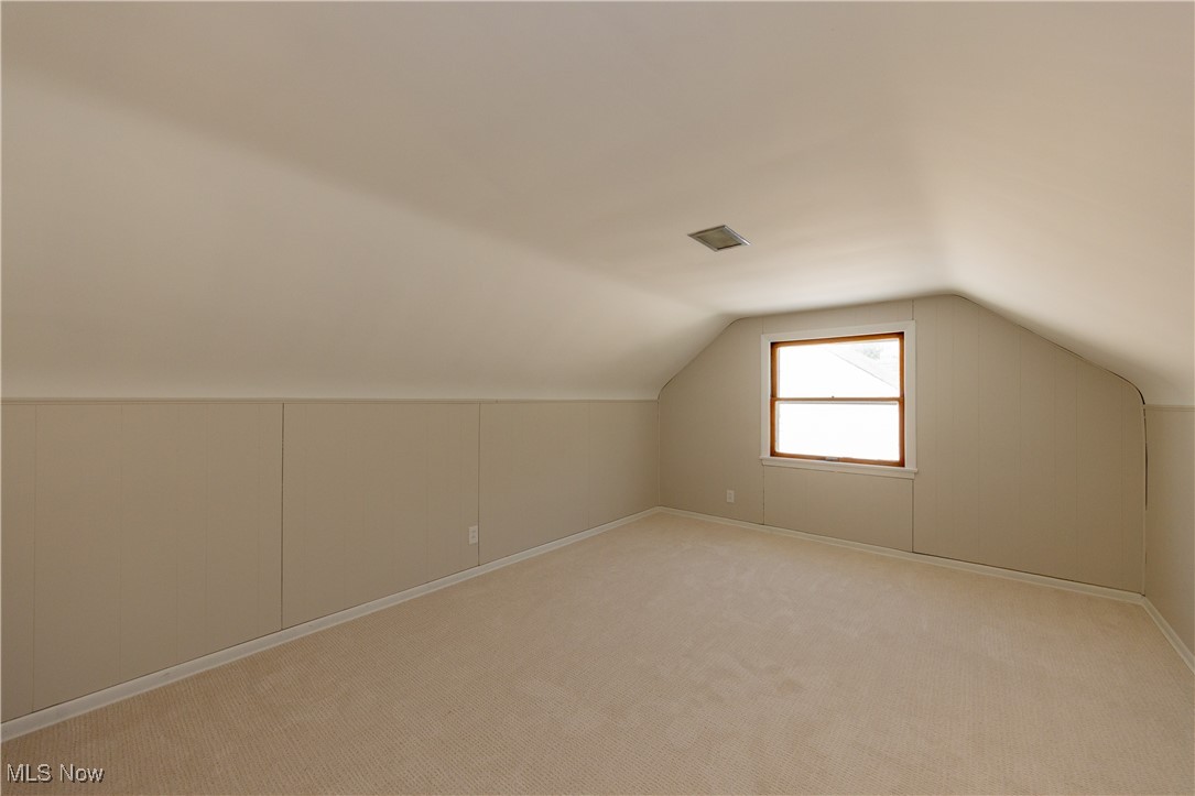 29103 Barjode Road Eastlake, OH 44095 - Photo 16 of 31 Additional living space featuring vaulted ceiling and carpet flooring