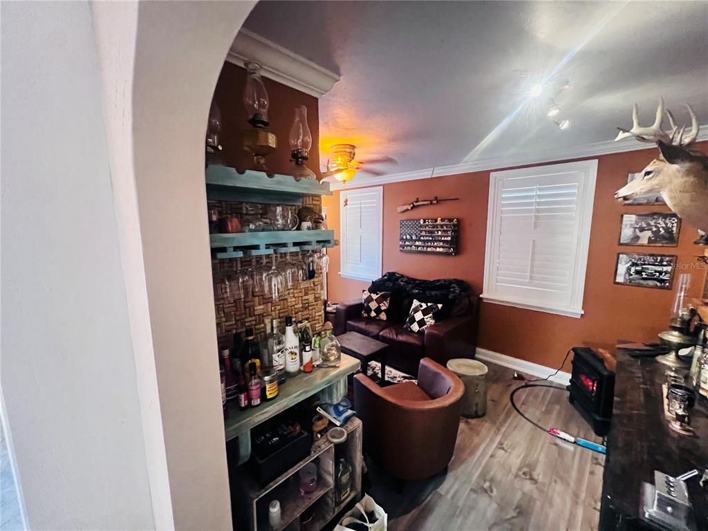 357 Tymber Run Ormond Beach, FL 32174 - Photo 15 of 32 a room with lots of bottles of alcohol sitting on a table