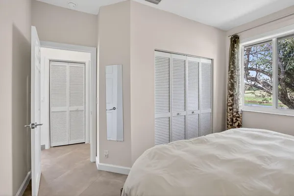 a bedroom with a bed and a walk in closet