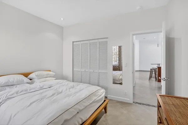 a bathroom with a sink toilet vanity and tub
