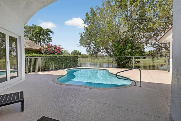 a view of a swimming pool with a patio