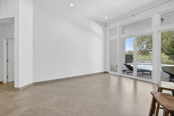 a kitchen with stainless steel appliances kitchen island granite countertop a refrigerator and a stove top oven
