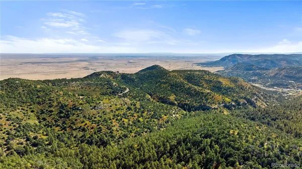 a view of a city with mountains in the background