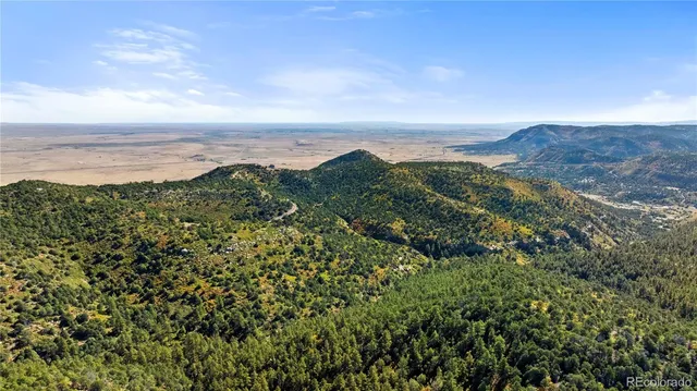 a view of a city with mountains in the background