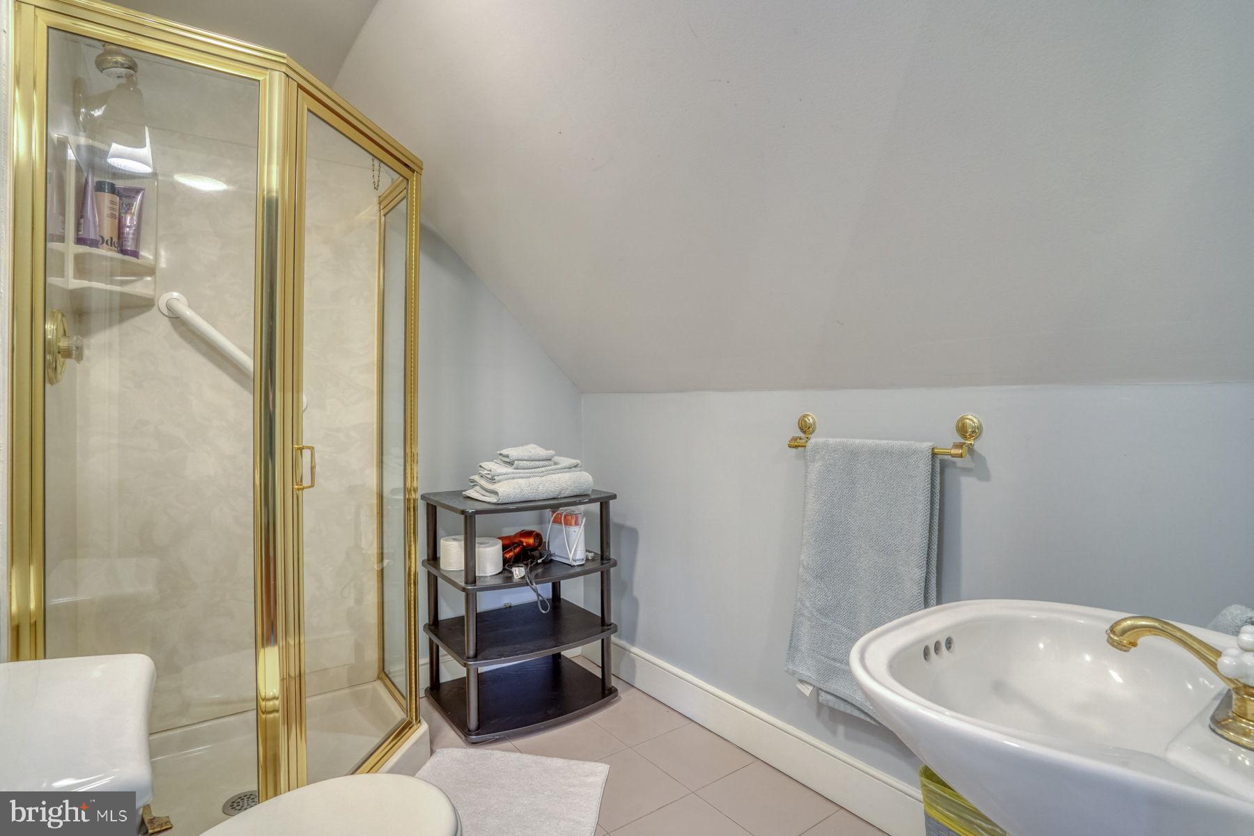 2 The Strand New Castle, DE 19720 - Photo 62 of 80 a bathroom with a sink and a tub