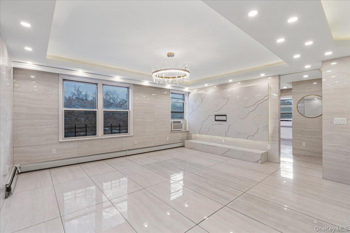 134-05 Dahlia Avenue, Unit 53A Queens, NY 11355 - Photo 3 of 13 a view of an empty room with a window