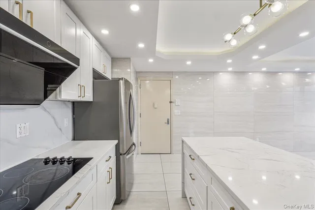 a kitchen with a sink stove and refrigerator