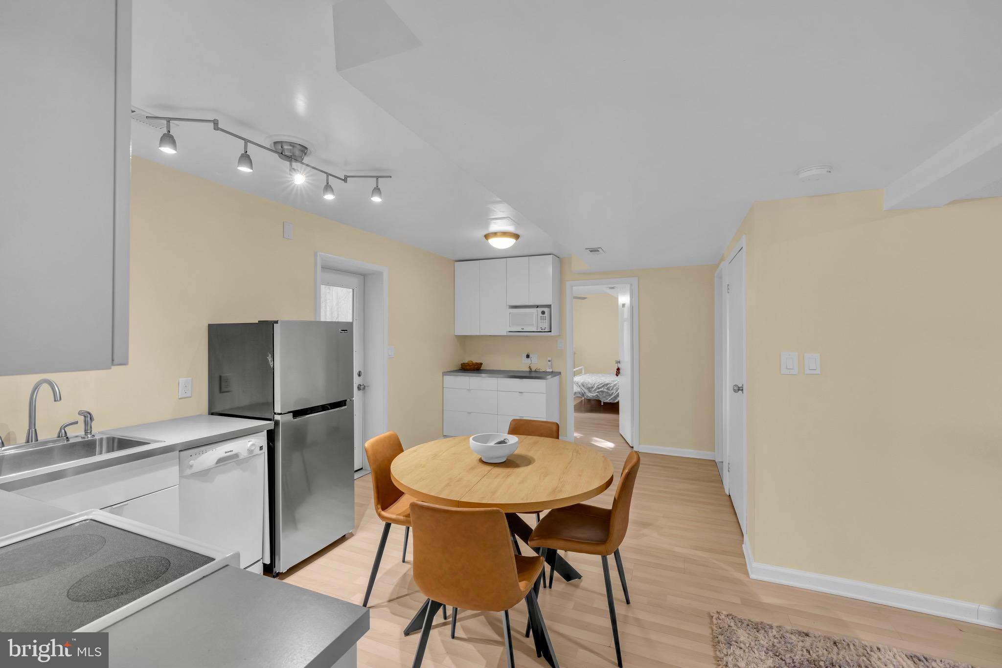 401 2nd Avenue Baltimore, MD 21227 - Photo 49 of 73 Modern kitchen with inviting dining space.