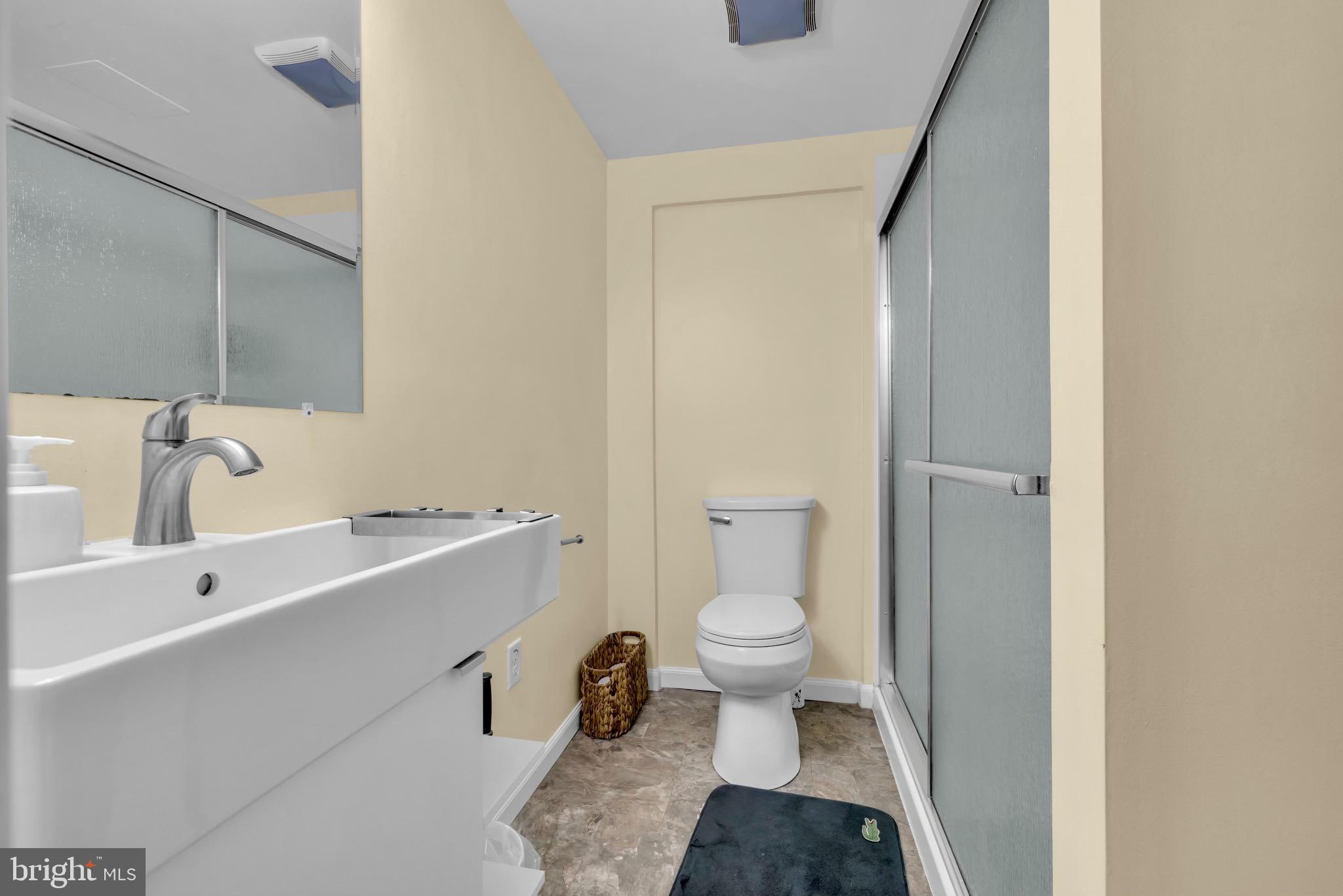 401 2nd Avenue Baltimore, MD 21227 - Photo 54 of 73 Modern bathroom with sleek finishes.