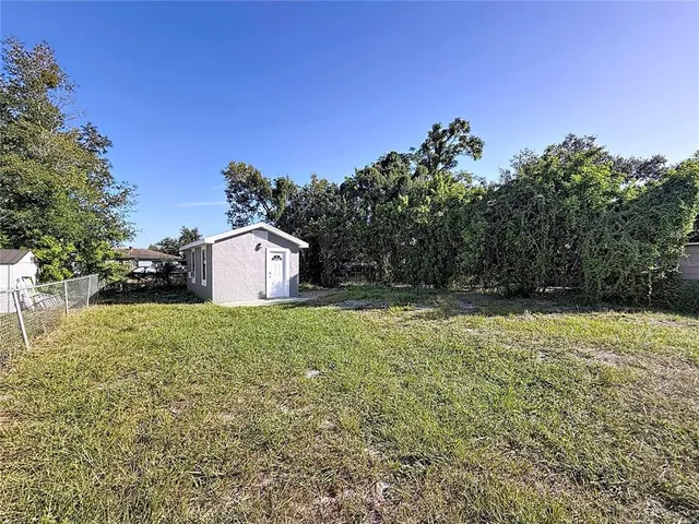 a backyard of a house with lots of green space