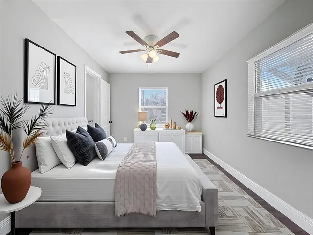 a bedroom with a bed and window