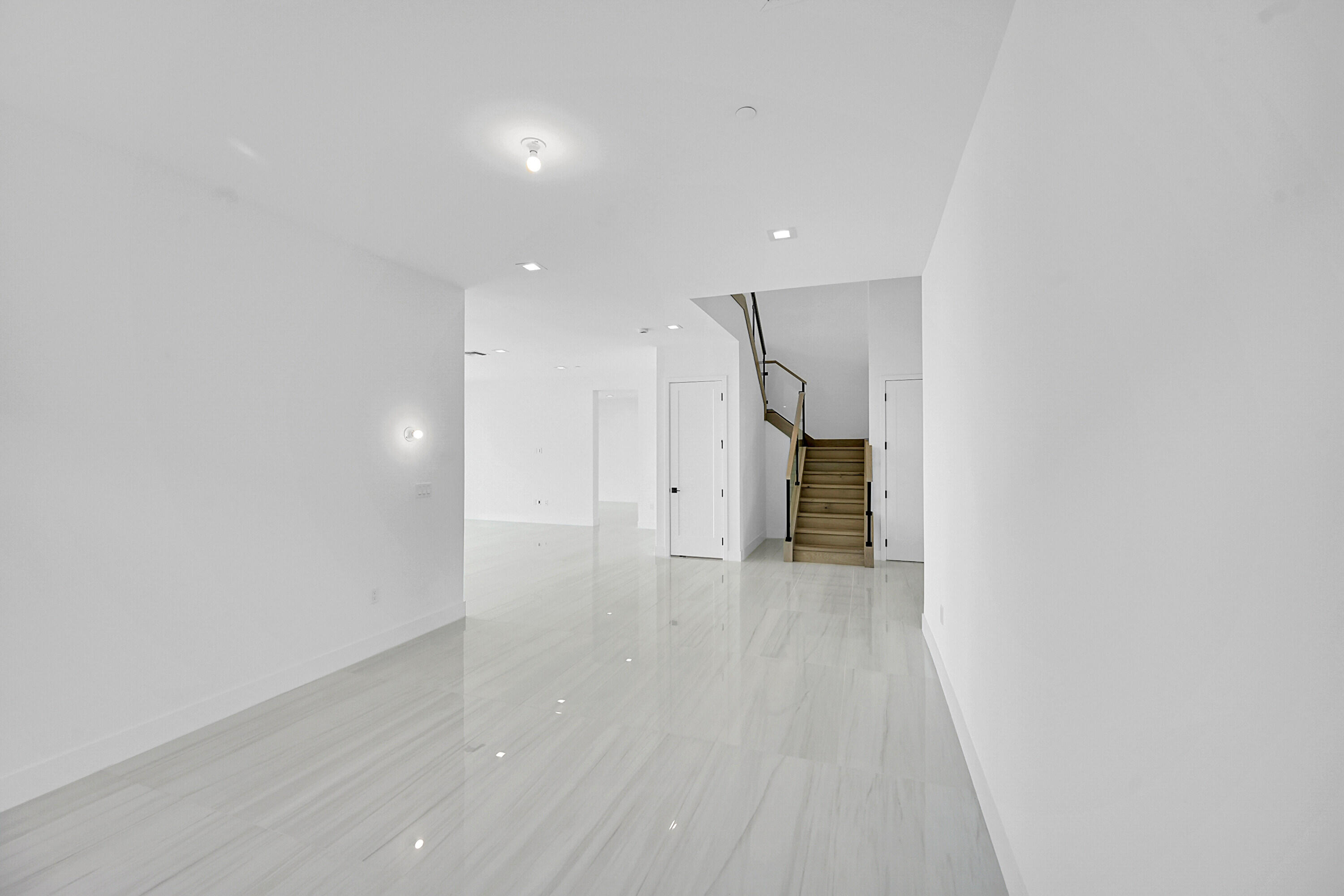 9979 Migration Point Palm Beach Gardens, FL 33412 - Photo 11 of 81 a view of an empty room with wooden floor and a window