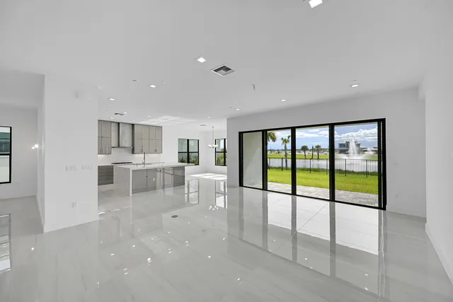 a view of empty room with floor to ceiling windows