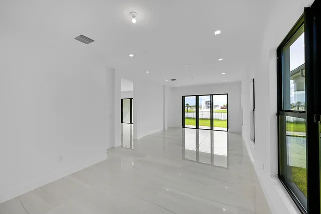 an aerial view of residential houses with outdoor space and swimming pool