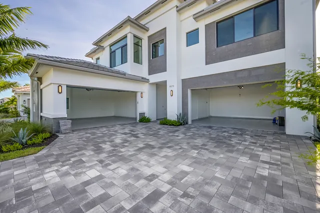 a large kitchen with kitchen island a sink stainless steel appliances and a counter top