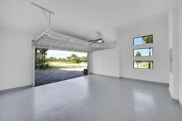 an empty room with large windows