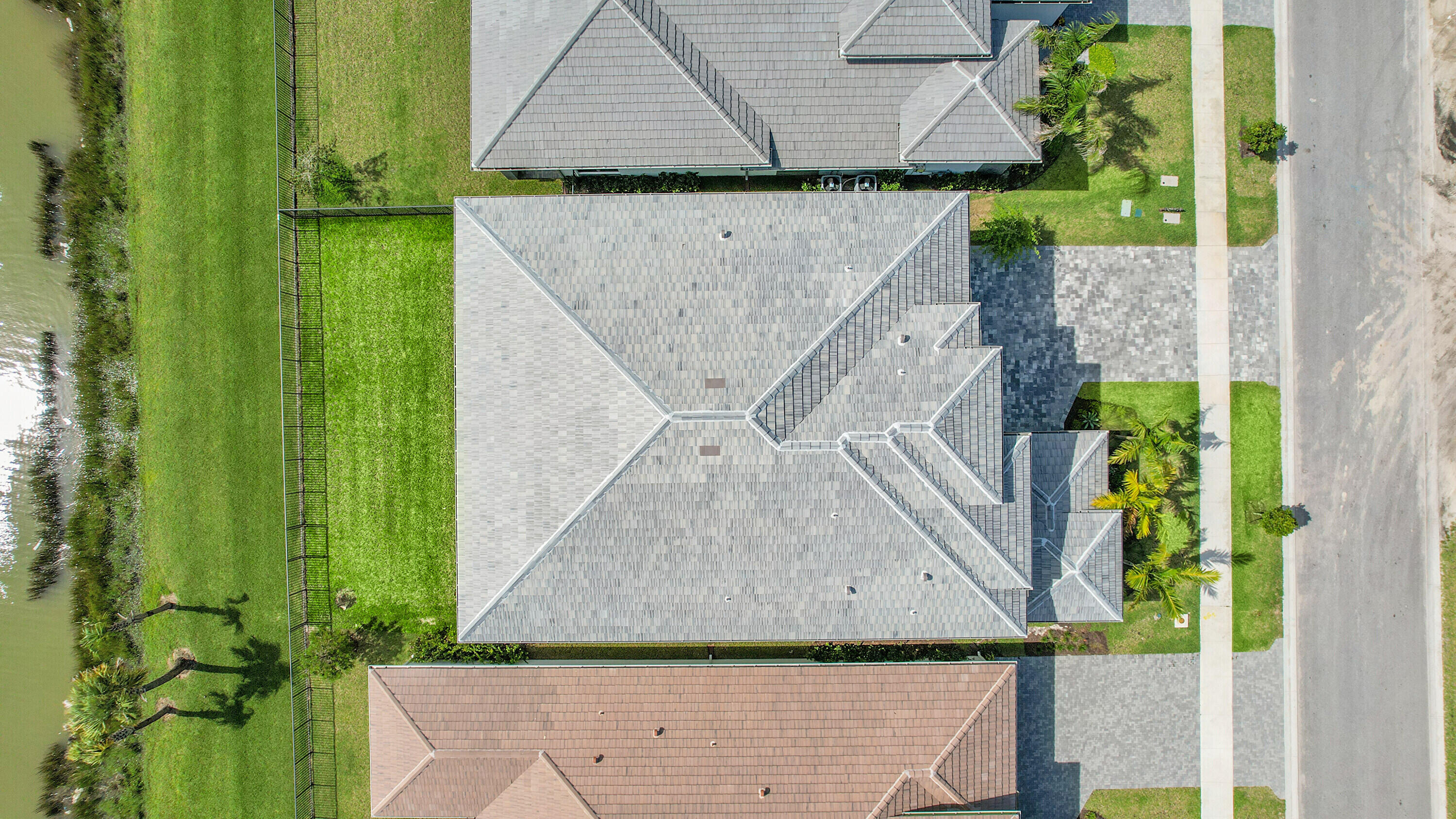 9979 Migration Point Palm Beach Gardens, FL 33412 - Photo 71 of 81 an aerial view of a house with a yard