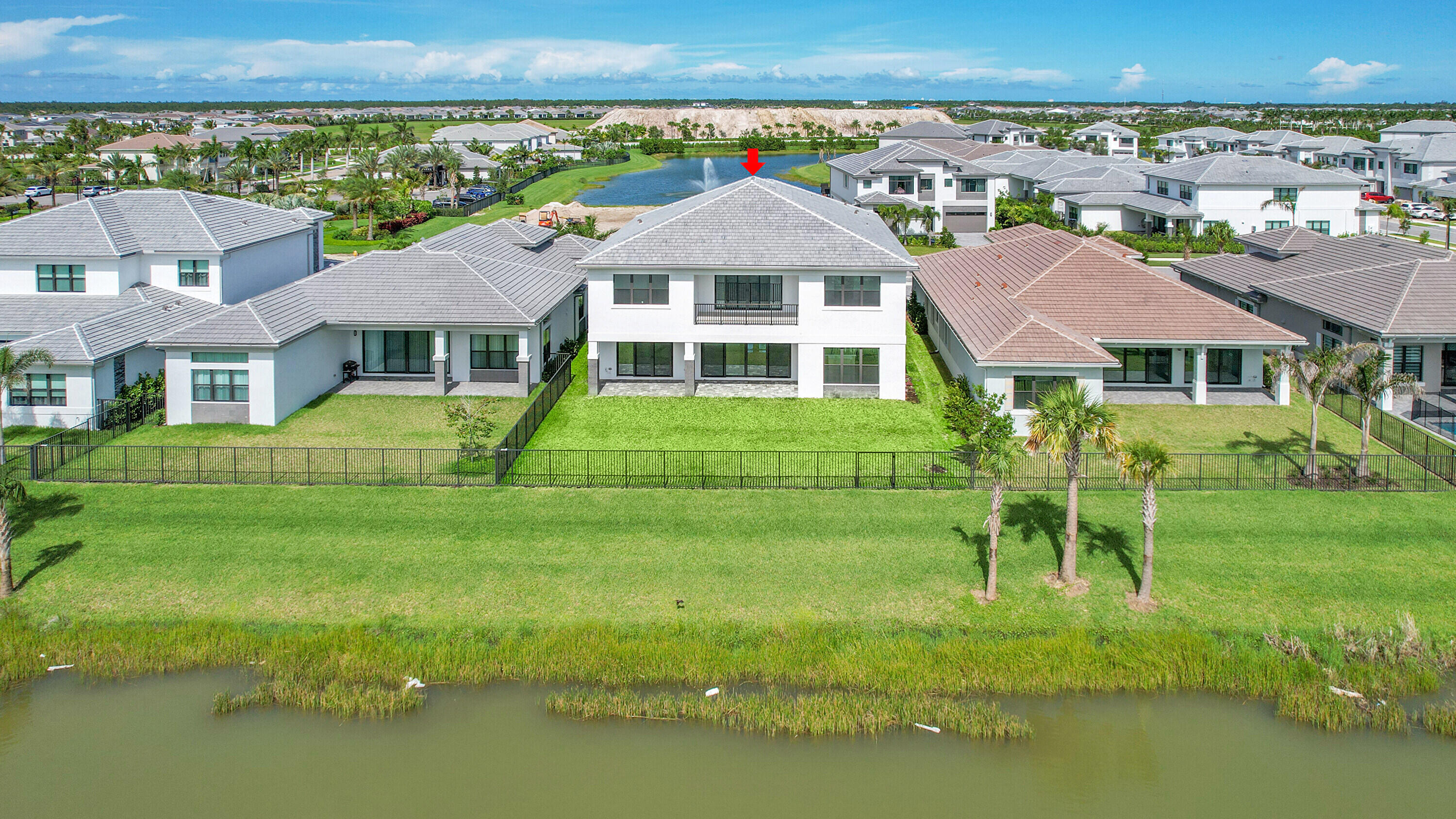 9979 Migration Point Palm Beach Gardens, FL 33412 - Photo 76 of 81 a front view of a house with a yard
