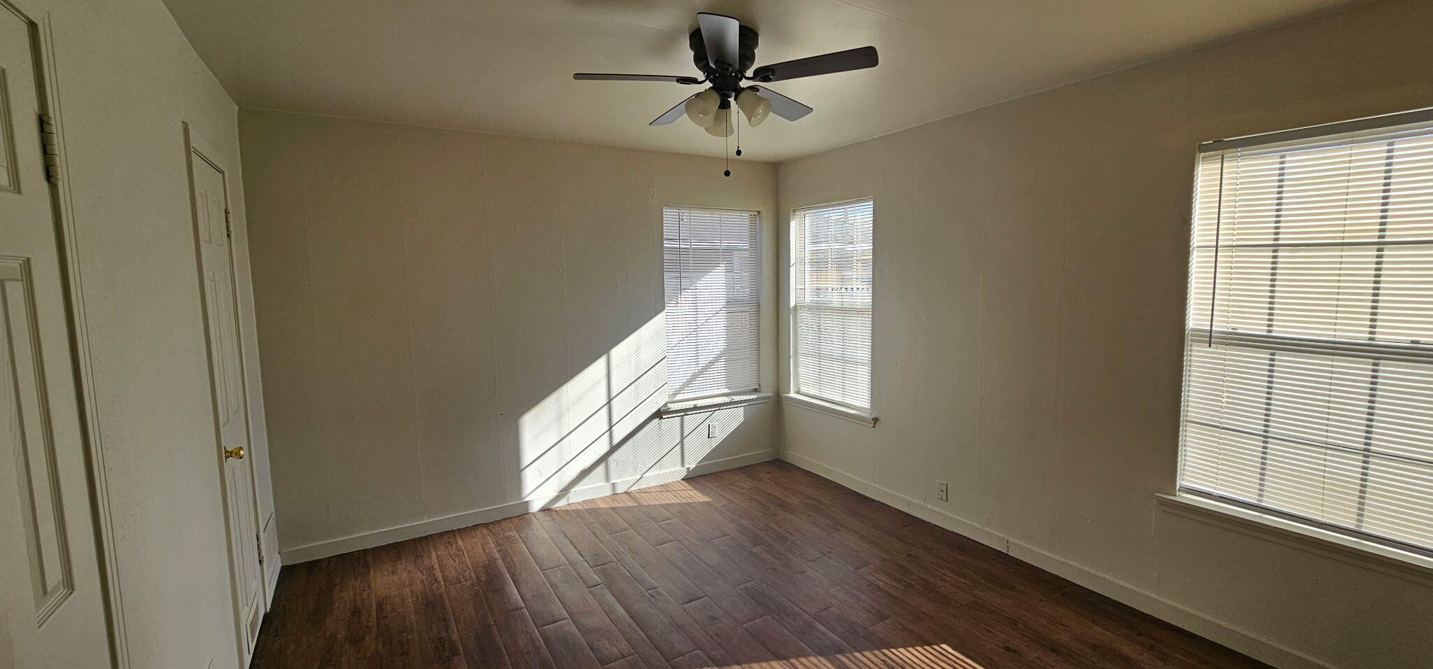 4319 33rd Street Lubbock, TX 79410 - Photo 2 of 6 a view of entryway and hall with wooden floor