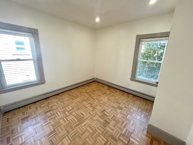 116 Prospect Street, Unit 1 Somerville, MA 02143 - Photo 16 of 21 a view of an empty room and window