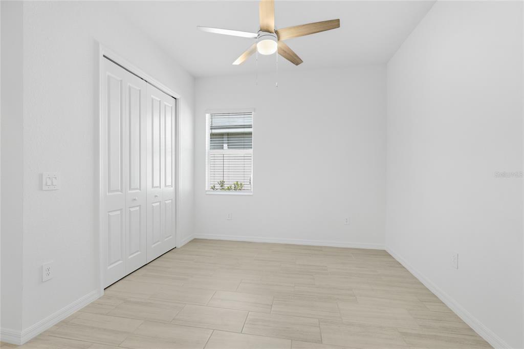19156 Cherrystone Way Lakewood Ranch, FL 34211 - Photo 15 of 49 an empty room with windows and fan