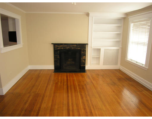75 Charles Street, Unit 4B Boston, MA 02114 - Photo 2 of 3 a view of an empty room with wooden floor and a window