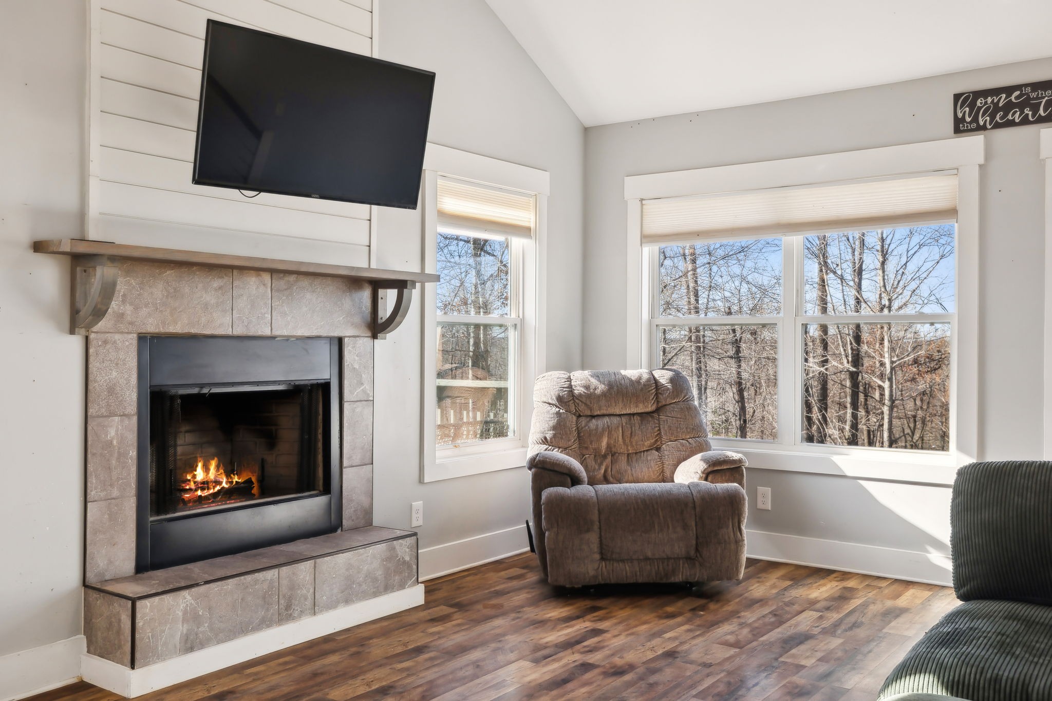 93 Halliburton Road Vanleer, TN 37181 - Photo 14 of 75 a living room with furniture a flat screen tv and a fireplace