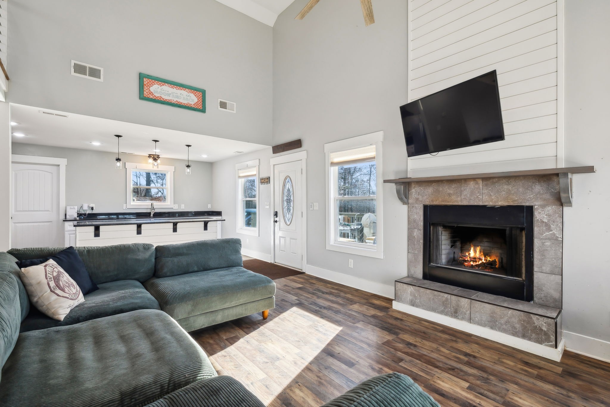 93 Halliburton Road Vanleer, TN 37181 - Photo 16 of 75 a living room with furniture and a fireplace