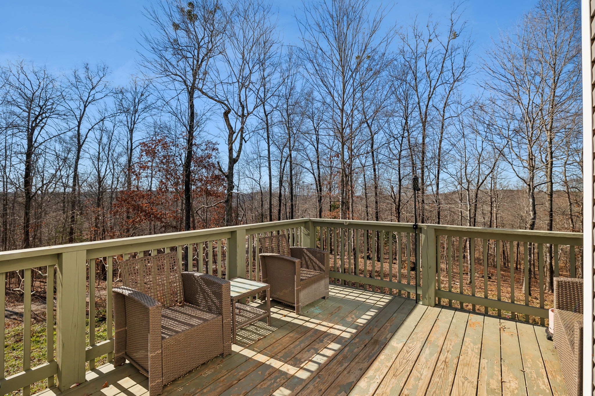 93 Halliburton Road Vanleer, TN 37181 - Photo 2 of 75 a view of balcony with wooden floor and outdoor seating