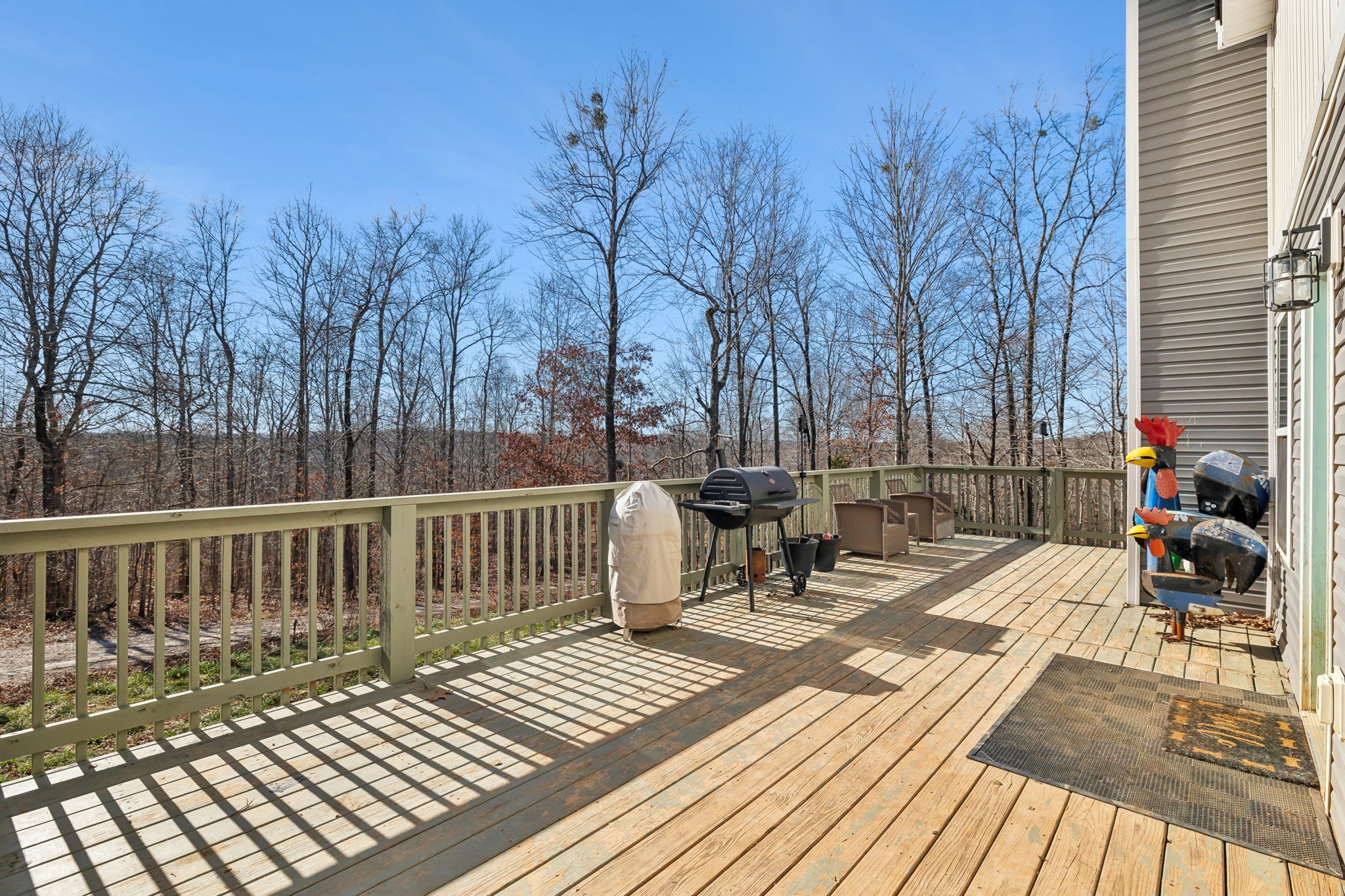 93 Halliburton Road Vanleer, TN 37181 - Photo 3 of 75 a view of a chairs on wooden deck