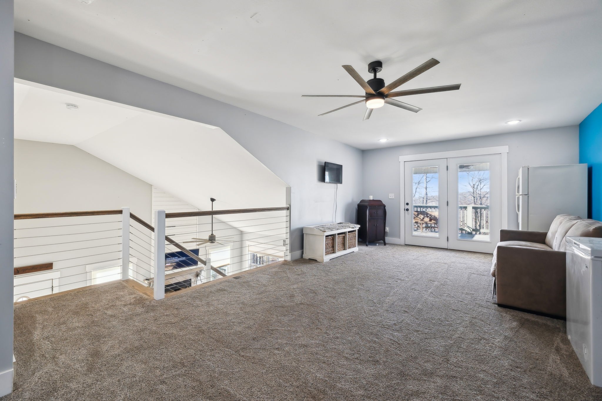 93 Halliburton Road Vanleer, TN 37181 - Photo 33 of 75 a living room with furniture and a ceiling fan