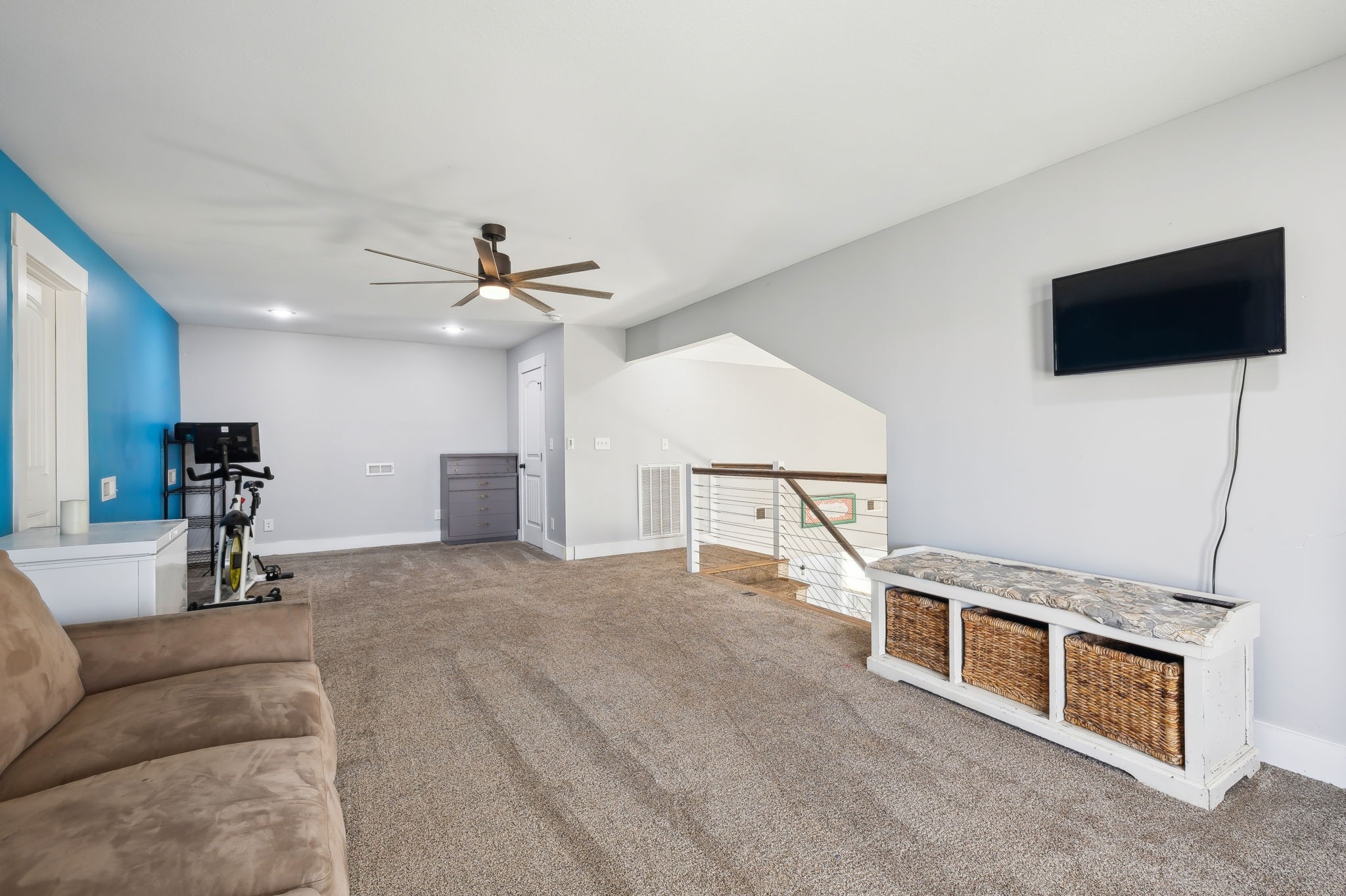 93 Halliburton Road Vanleer, TN 37181 - Photo 34 of 75 a living room with furniture a flat screen tv and a ceiling fan