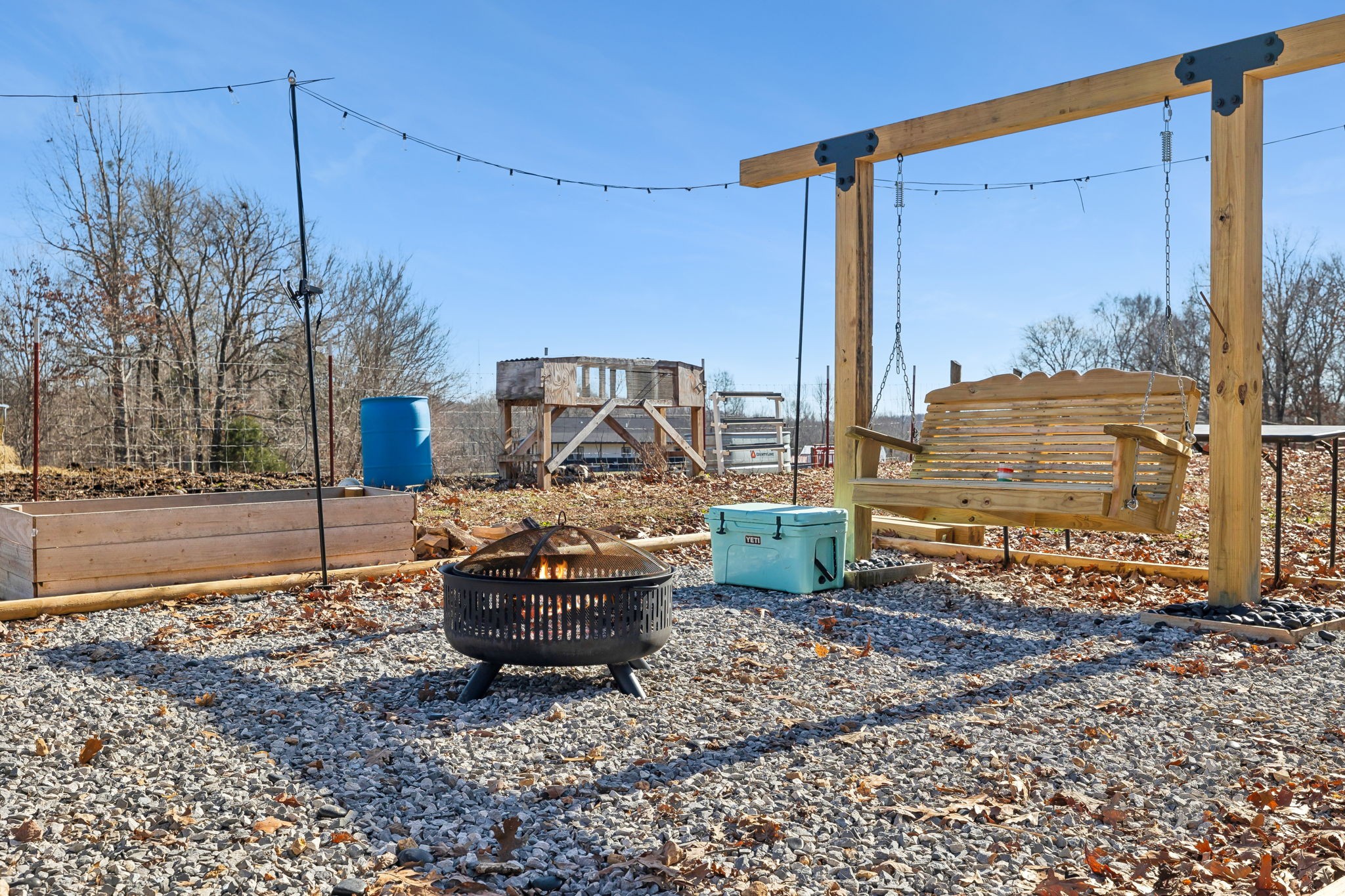 93 Halliburton Road Vanleer, TN 37181 - Photo 44 of 75 a view of water from a chair and fire pit