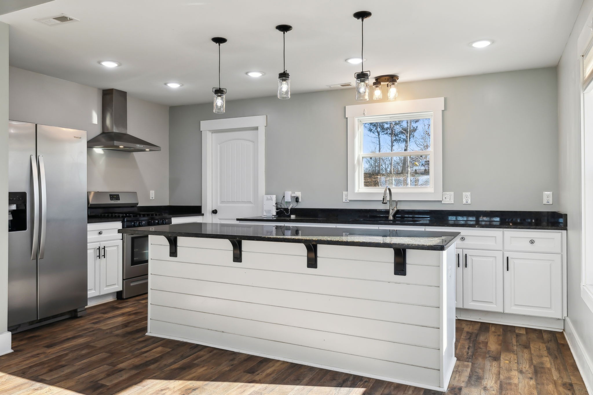93 Halliburton Road Vanleer, TN 37181 - Photo 5 of 75 a kitchen with kitchen island granite countertop a sink cabinets and stainless steel appliances