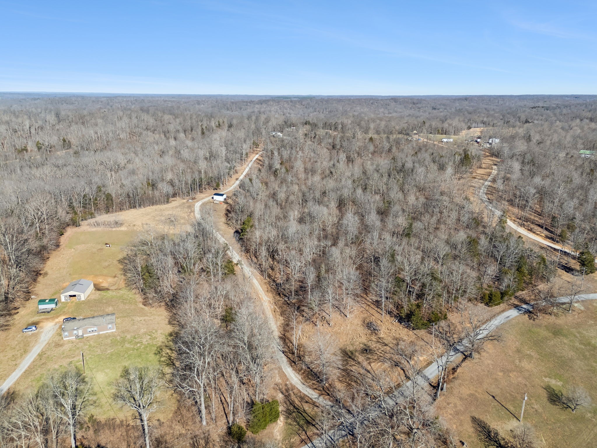 93 Halliburton Road Vanleer, TN 37181 - Photo 72 of 75 a view of a dry yard with wooden fence
