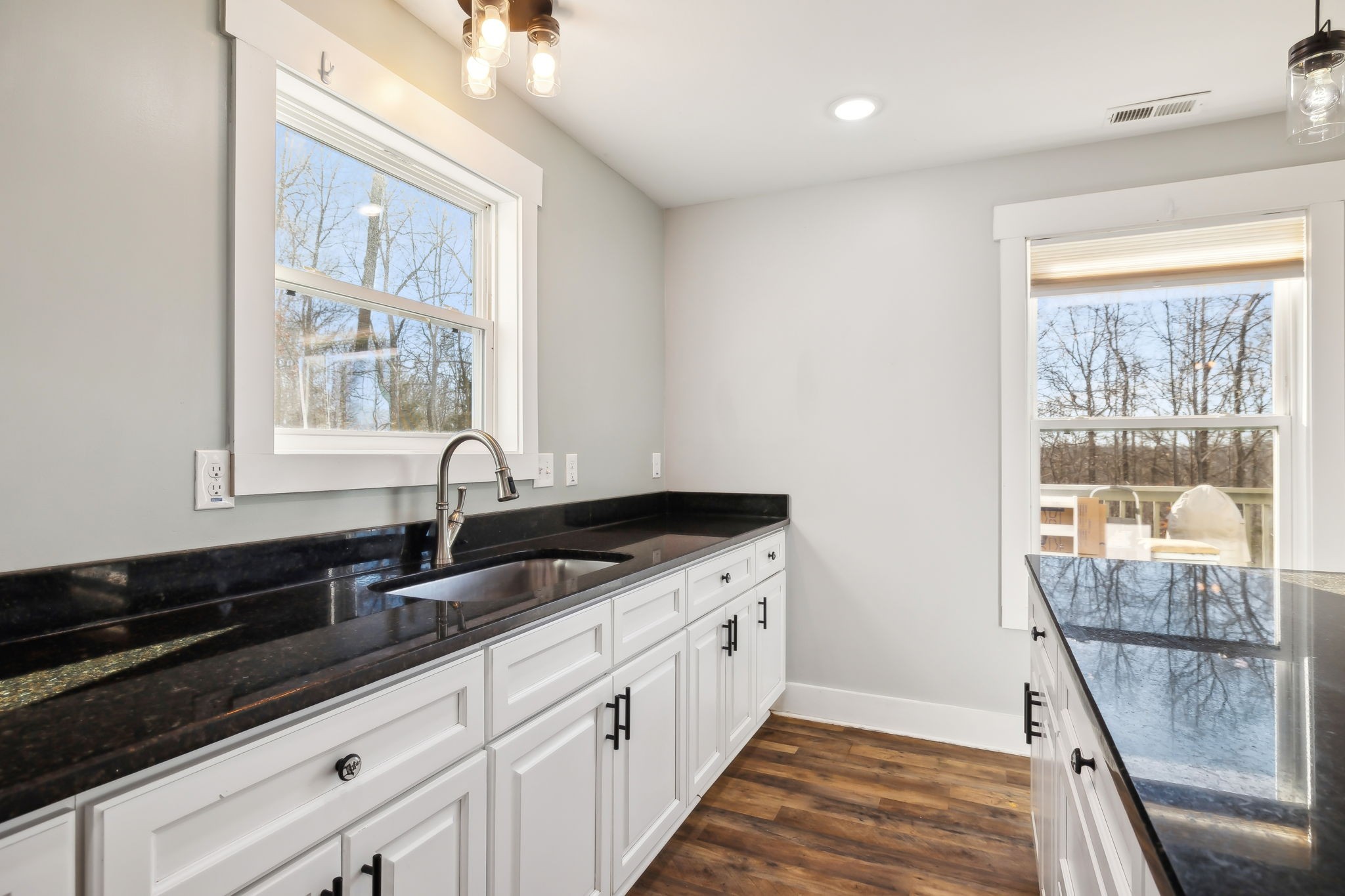 93 Halliburton Road Vanleer, TN 37181 - Photo 9 of 75 a kitchen with granite countertop a sink and a window