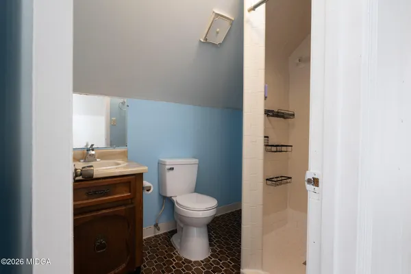 a bathroom with a toilet and a sink