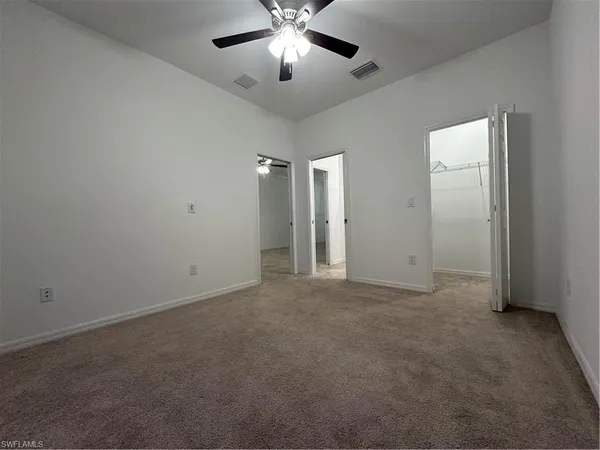 a view of a hallway with staircase