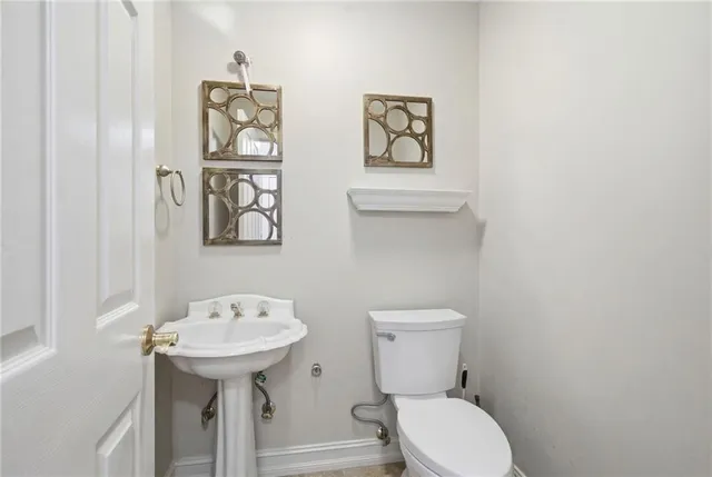 a spacious bedroom with a bed and a table in it