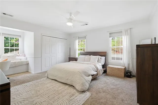 a spacious bathroom with a double vanity sink mirror double and shower